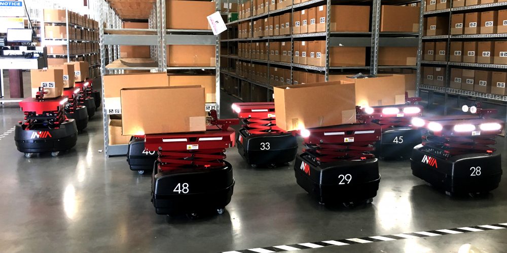 inVia robots moving totes through a warehouse