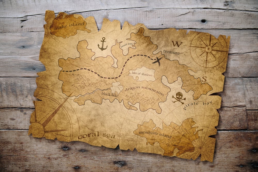 Old treasure map on a wooden table