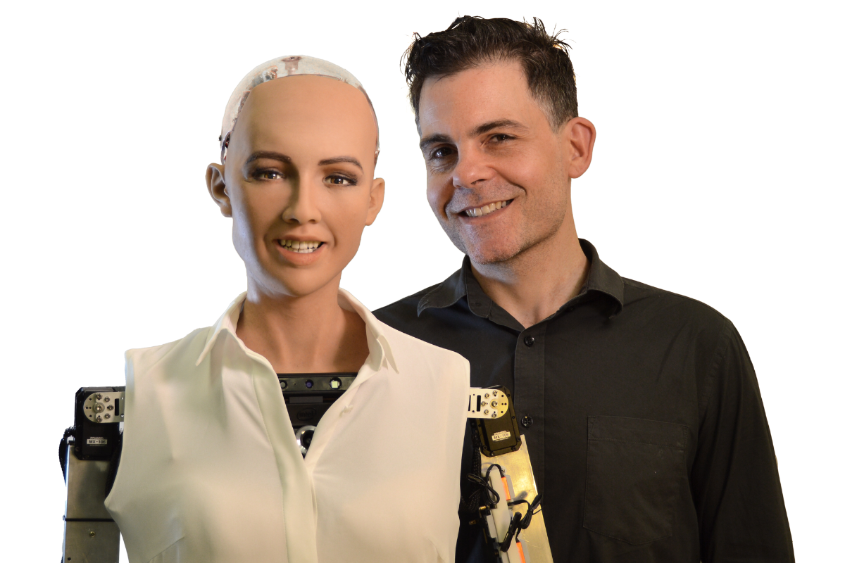 An image of Hanson Robotics' Sophia robot, standing next to her creator David Hanson